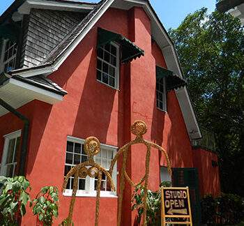 Human-like woven structures on display in front of the artists studio at Deering Estate.