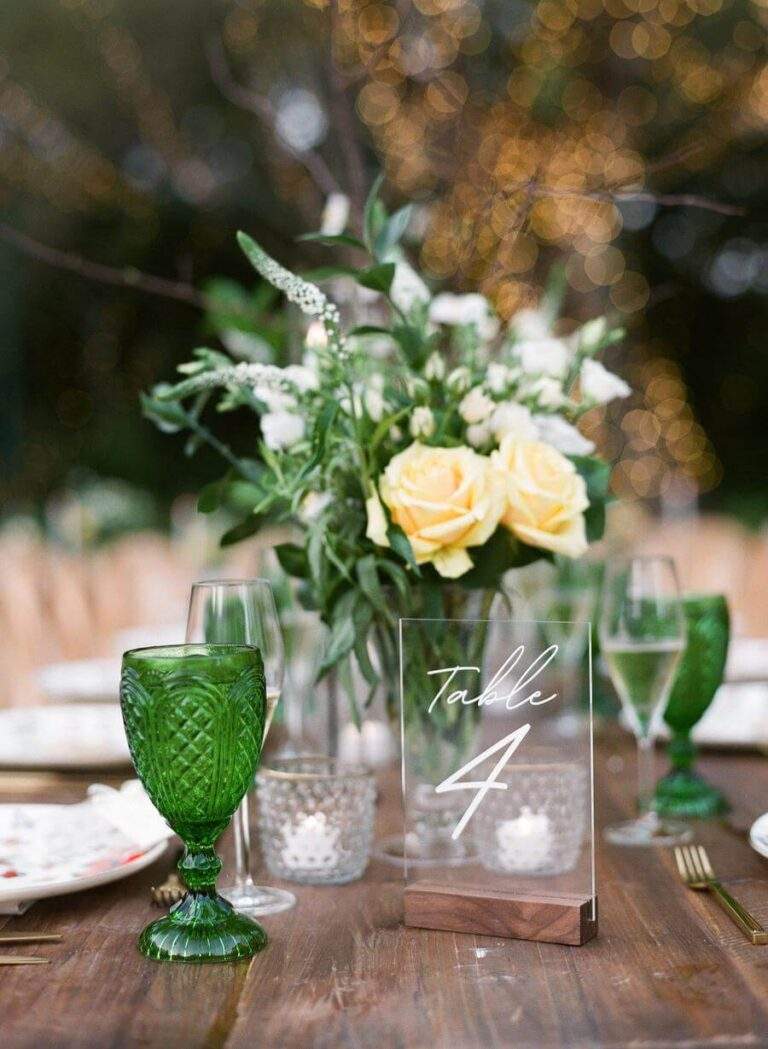 Reception table detail at Deering Estate's Courtyard with the string-light wrapped Oak Tree in the background